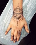 Kaja_memento_tattoo_hand_arm_mandala.jpg